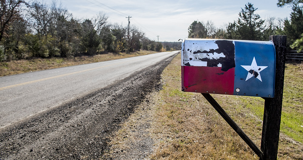 A mailbox painted to look like the Texas flag